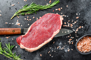 Fototapeta na wymiar Striploin, strip loin steak or new York. Raw beef. Black background. Top view
