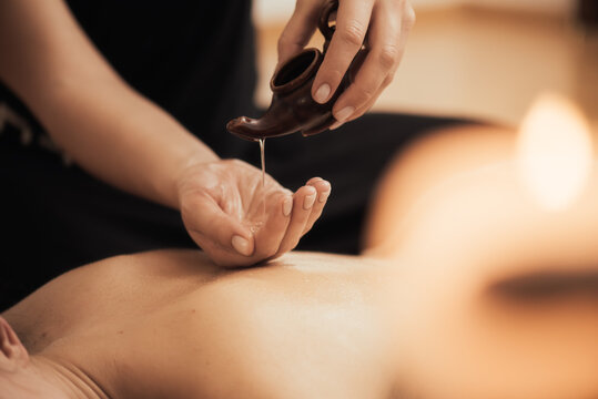 Spa woman. Female enjoying relaxing back massage in cosmetology spa centre. Body care, skin care, wellness, wellbeing, beauty treatment concept.