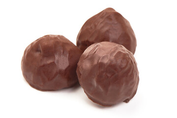 Chocolate candies close-up, isolated on white background