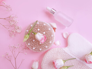 massage brush, flower on a colored background