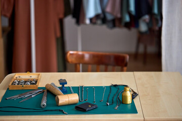 close-up photo of workshop location. tools. desktop. jewelry master's table for creating rings