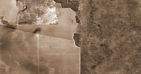 a country exhausted, United States, abstract photography of relief drawings in  fields in the...