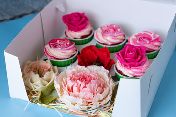 Edible flowers made from chocolate. An original dessert in a box.