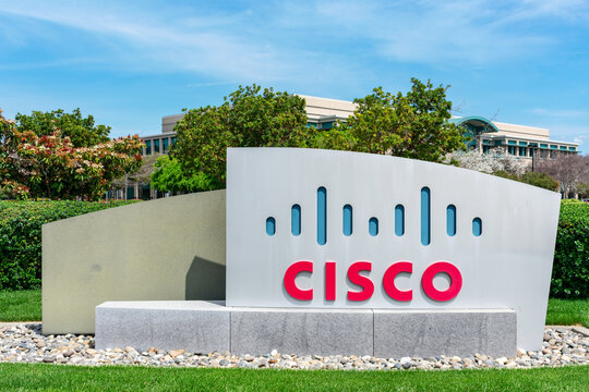 Cisco sign near Cisco headquarters campus in Silicon Valley. The red and blue logo depicts the two towers of the Golden Gate Bridge. - San Jose, California, USA - 2020