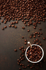 Grains of coffee drink and pieces of cane sugar in zero waste paper cup on grains background. Plastic free concept. Selective focus.