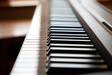 Close up of piano keys at day light, in black and white colors