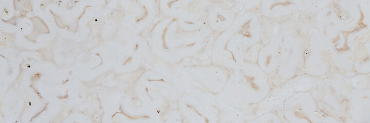 Dolomite texture. Natural rock with beautiful beige patterns on the surface. Polished flat stone. Classic luxury decoration building material. Wide panoramic texture for background and design.
