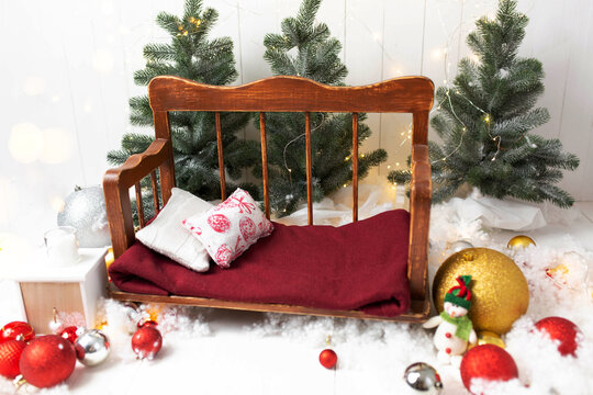 background texture. decorated with Christmas decorations for a photo shoot of newborns. furniture for dolls. Christmas balls toys