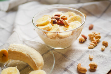 Overnight oats with banana slices and nuts. Home cooked breakfast. Vegetarian meal. Healthy recipes