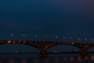 Fototapeta na wymiar Bridge over the Volga river in the city of Saratov at night.