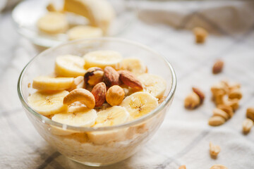 Overnight oats with banana slices and nuts. Home cooked breakfast. Vegetarian meal. Healthy recipes