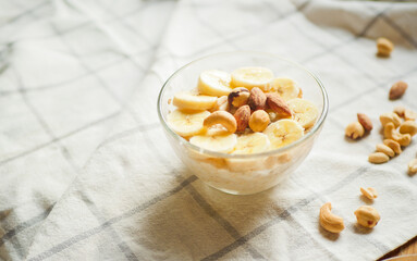 Overnight oats with banana slices and nuts. Home cooked breakfast. Vegetarian meal. Healthy recipes