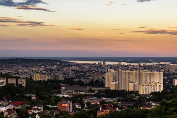 View on the high-rise residential building and the rest of the city from the hollow between the mountains. Shallow focus.