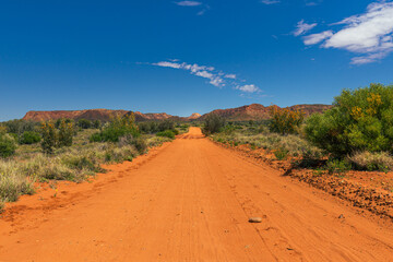 Sandy, unpaved road in the outback in Australia