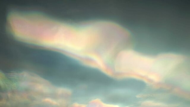 Nacreous polar stratospheric clouds bird flying silhouettes