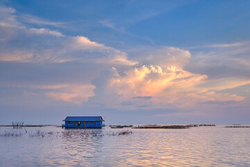 A calm sunset over a floating house