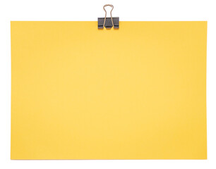 Blank yellow sheet of paper hanging on a paper clip on a white background. Post note, sheet. Office...