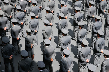 Military army troops in form during patent graduation ceremony at headquarters, high angle of view....