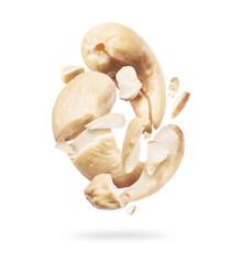 Crushed cashew in air close up, isolated on white background
