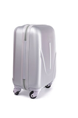 Travel suitcase isolated. Silver plastic luggage or vacation baggage bag on white background. Design of summer vacation holiday concept.