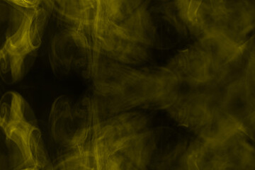 Yellow steam on a black background.