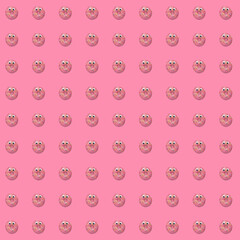 Seamless repeating pattern of pink donut doughnut with sprinkles on a pink background 
