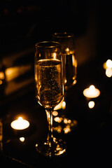 Celebration.Glasses of wine. The concept of Valentine's Day. Bokeh in the background of glasses are shaped like heart.