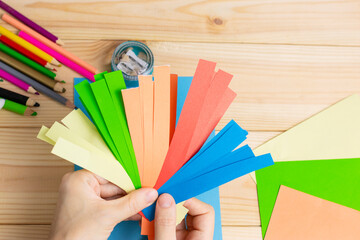 Child cut out of colored paper. Kid making birthday card. Happy mothers day and happy 8 march. Kids...