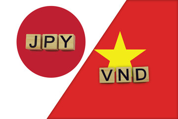 Japan and Vietnam currencies codes on national flags background