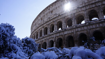 Colosseum under snow on a sunny day.  Snowing in Rome, Italy