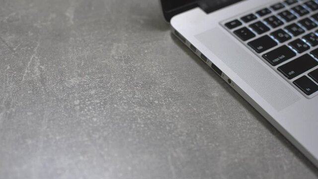 Connect a usb flash drive key to the port of a laptop pc computer.
