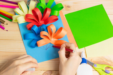 Child cut out of colored paper. Kid making birthday card. Happy mothers day and happy 8 march. Kids Art. DIY idea. Step by step. photo instruction.