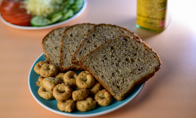 cereal dietary bread with round croutons, on blue background