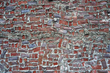 Rough red brick wall texture with a background pattern