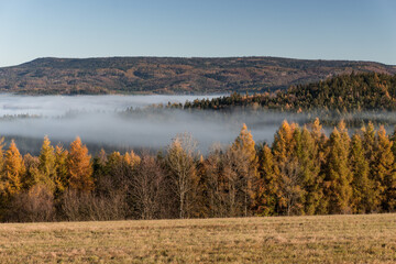 Bohemian hills covered by a morning haze