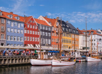 Fototapeta na wymiar Scenic summer view of color buildings and boats of Nyhavn in Copenhagen, Denmark