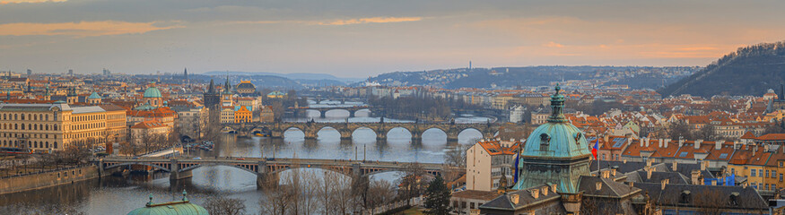Fototapeta na wymiar Beautiful spring sunset over the old city of Prague with wide angle view of the bridges over the Vltava river
