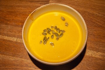 Creamy pumpkin soup with the pumpkin seed on top, served in Saint Petersburg, Russia