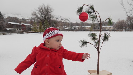 Baby with Charlie Brown Christmas Tree