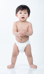 little baby learning to stand isolated a on white background - 403312770