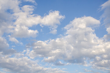 Naklejka na ściany i meble Blue sky with abstract gray clouds