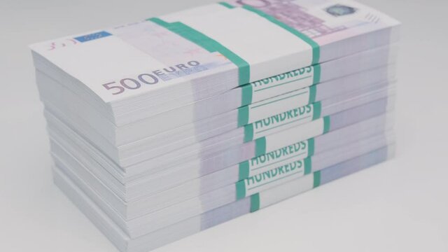stack of bank of five hundred euro bills rotating on white background.