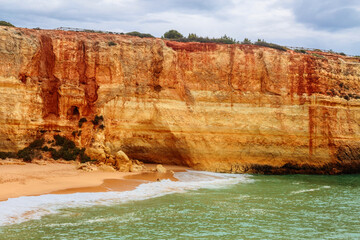Sandy beach with stony ridges overcast weather view