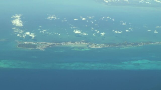 Flying over The Bahamas. Beautiful ocean colors. Actual aerial footage.