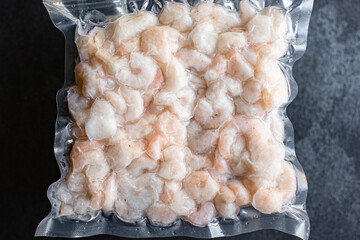 frozen shrimp shelled semi-finished seafood ready to cook and eat on the table for healthy meal...
