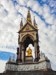 Fototapeta na wymiar The Albert Memorial against blue sky in Kensington Gardens, London. 