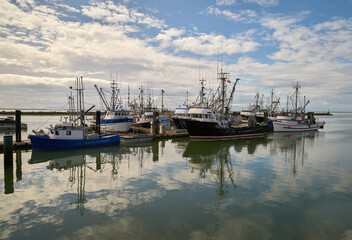 Fototapeta premium Steveston Harbour Commercial Fishboats. Commercial fishboats in the harbor of Steveston, British Columbia, Canada near Vancouver. Steveston is a small fishing village on the banks of the Fraser River 