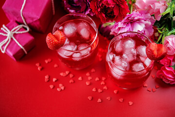 Obraz na płótnie Canvas Red Valentine's day cocktail in a glass
