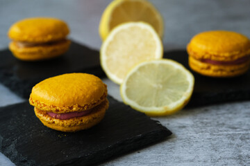 yellow lemon macaroni cookies on a gray background
