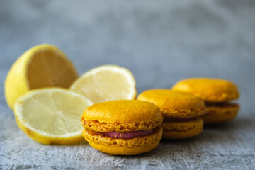 yellow lemon macaroni cookies on a gray background